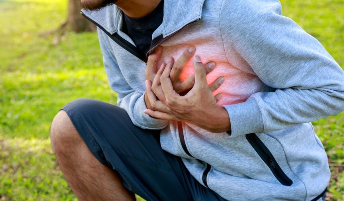 Man having heart attack or heart failure after running at park, Exhausted, tired, illness or over train concept